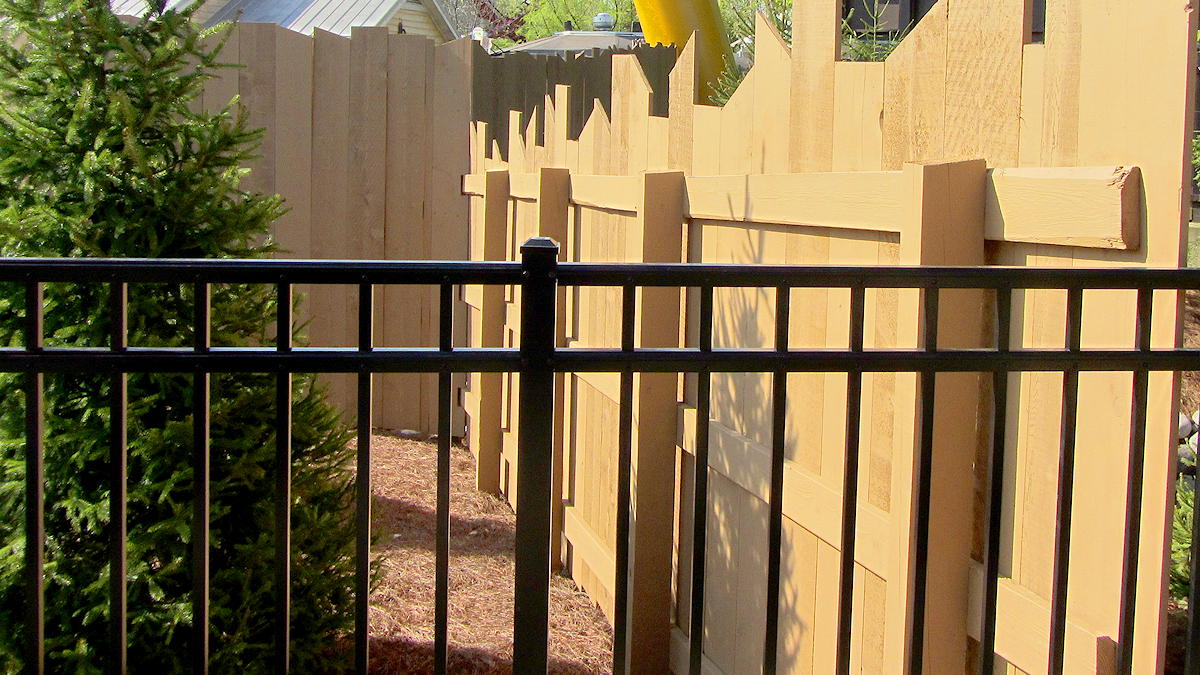 Aluminum fencing blends beautifully with existing fencing.