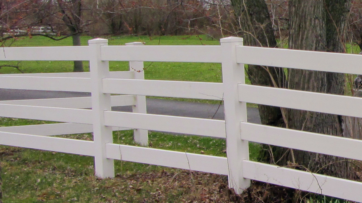 Vinyl fences come in a variety of styles and colors including this classic four rail fence.