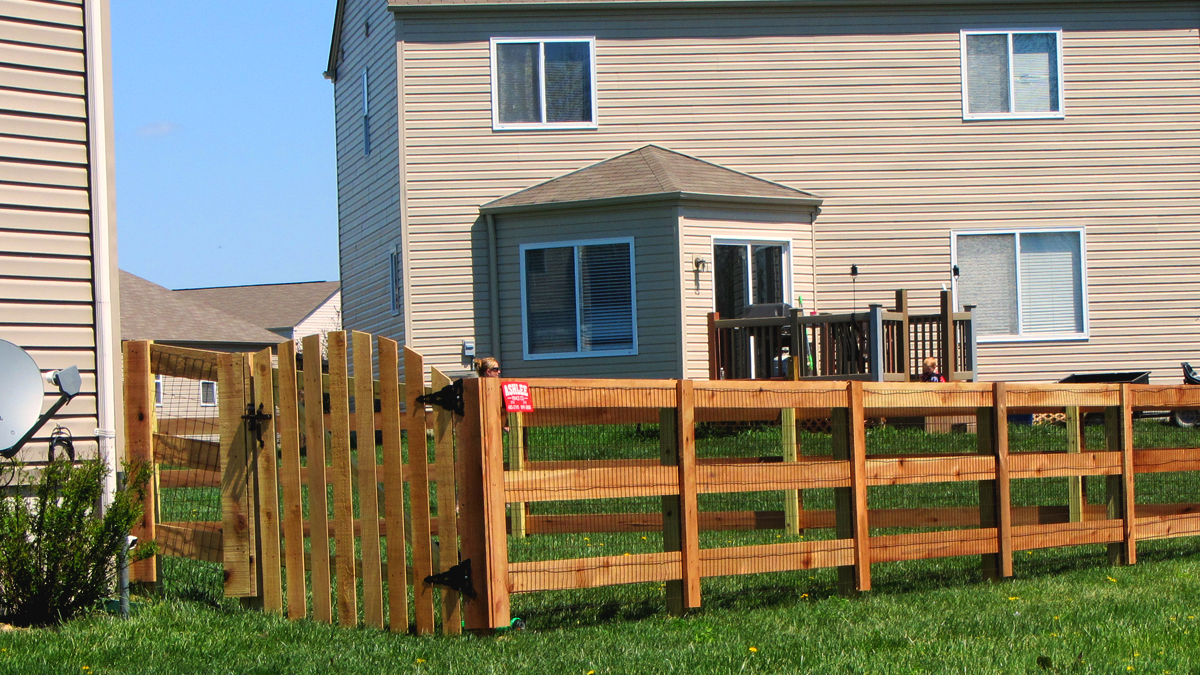 A wood fence is the perfect solution when the safety of children or pets is involved.